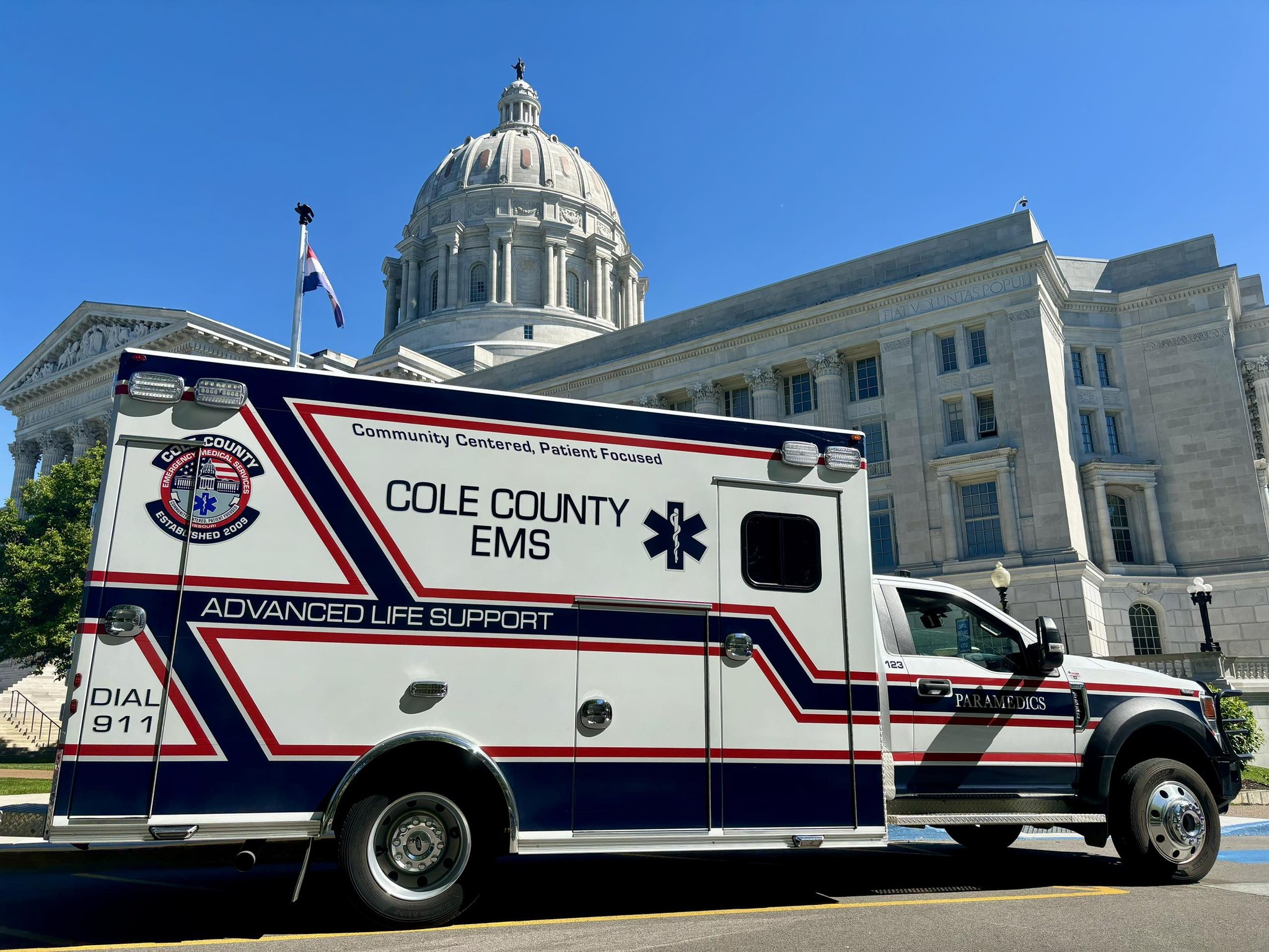 Photo of a Cole County EMS Ambulance in front of the State Capital in Jefferson City MO